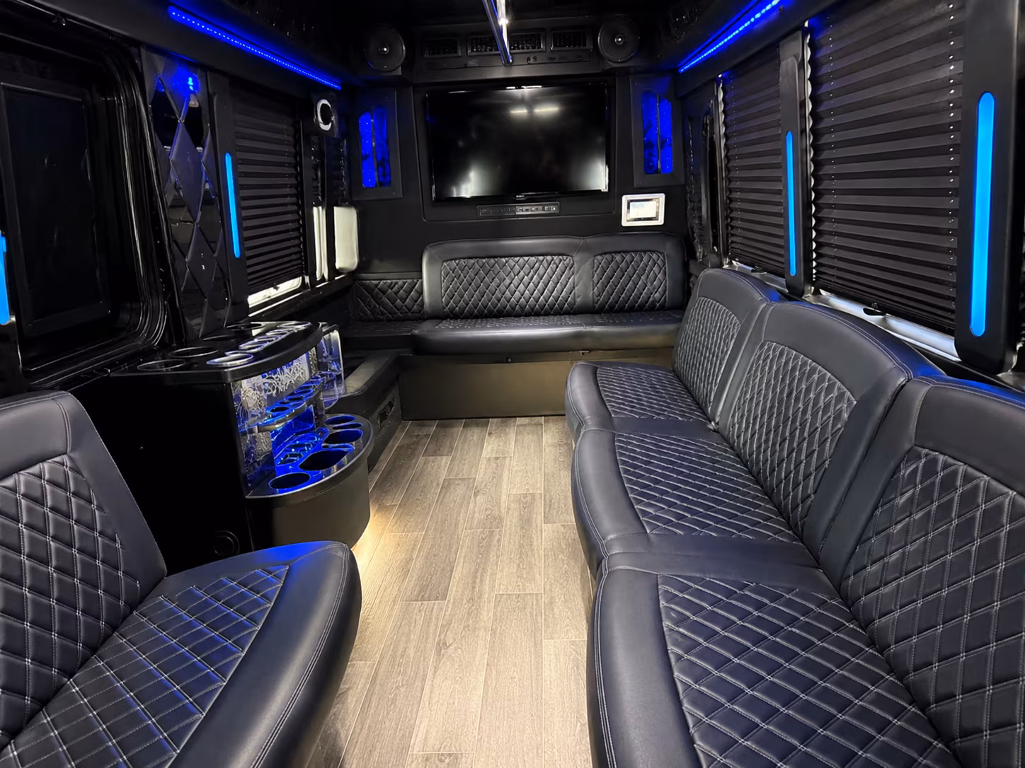 Friends laughing during a party bus celebration in Salt Lake City